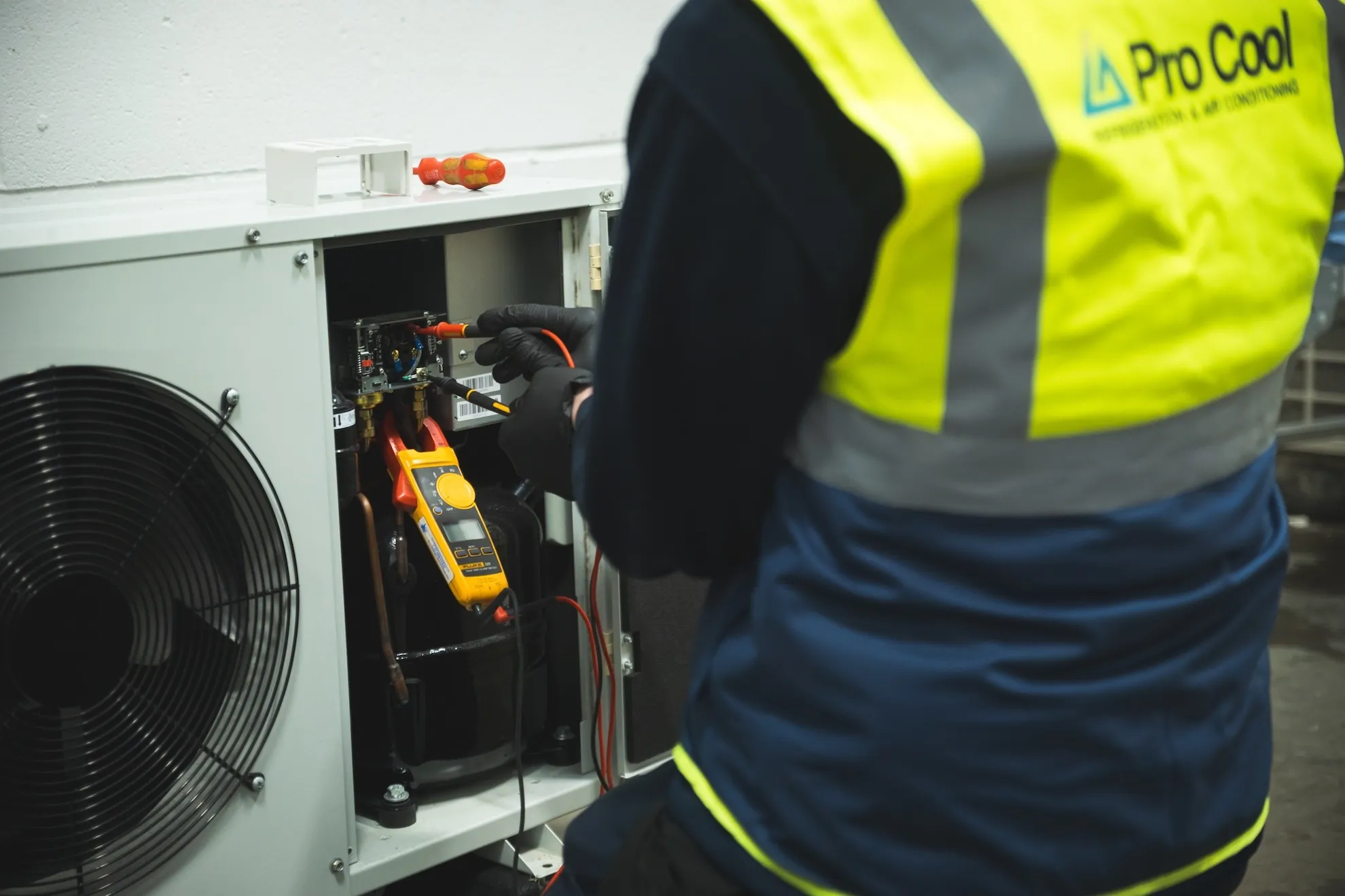 LA Pro Cool engineer working on an air conditioner