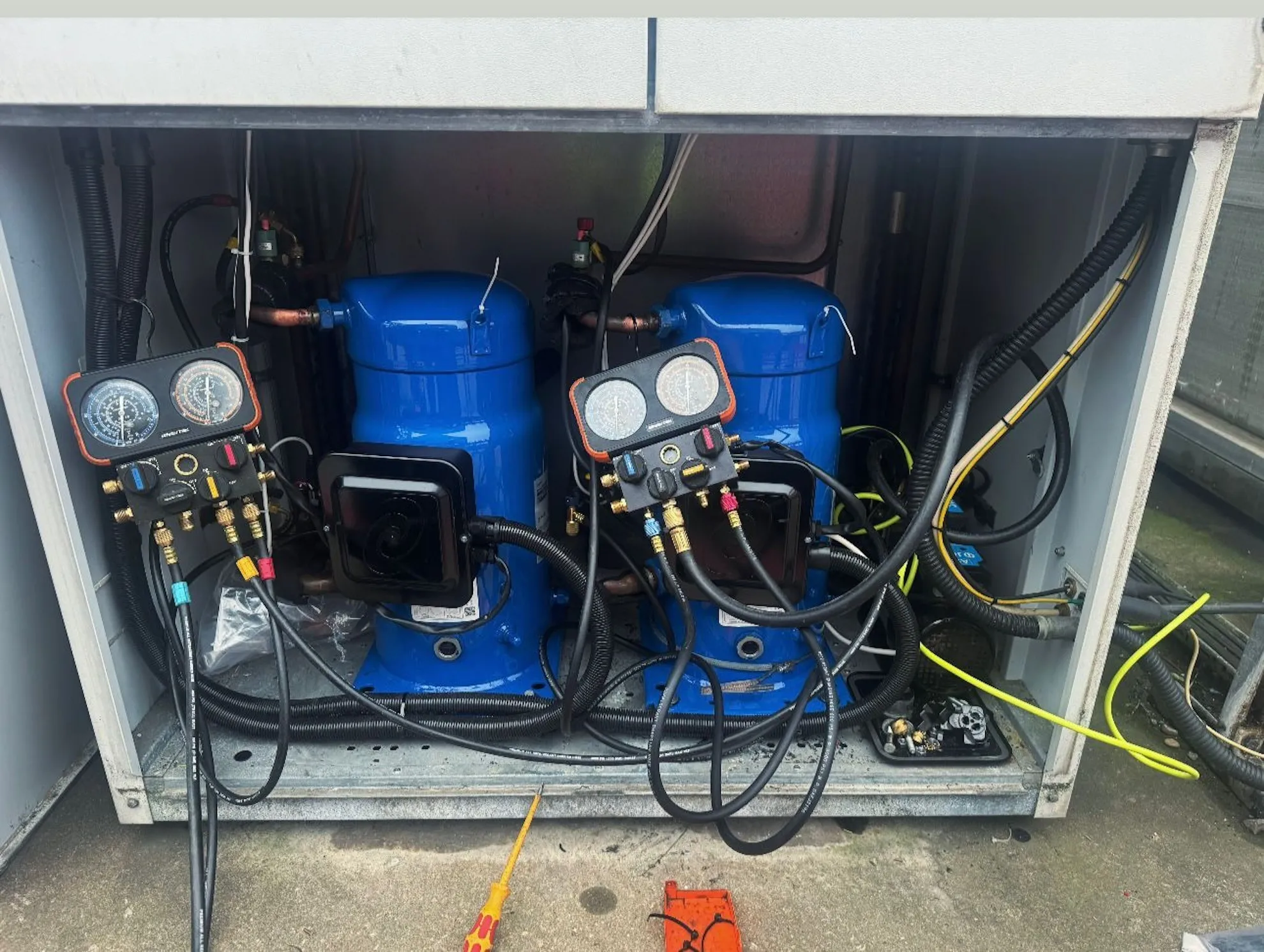 Commercial air-cooled water chiller unit undergoing maintenance or installation.