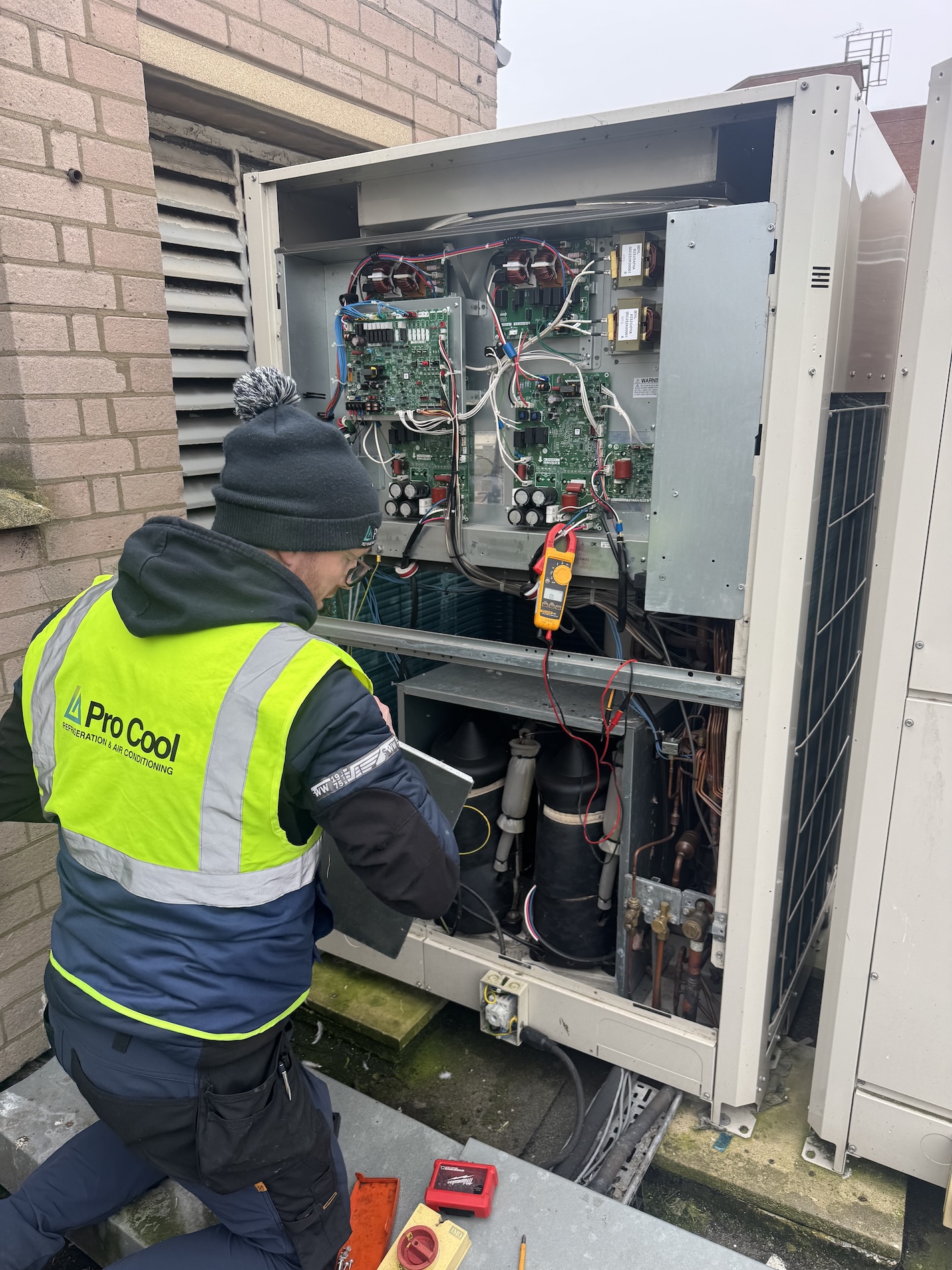 Engineer working on the PCBs of an HVAC unit